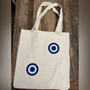 Brand new evil eye canvas tote bags.